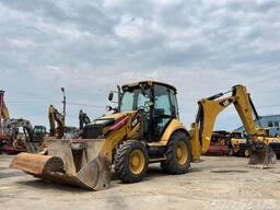 Аренда погрузчика- экскаватора caterpillar