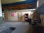 Аренда склада, помещение гаражного типа с ограждаемой стояночной территорией - фото 1